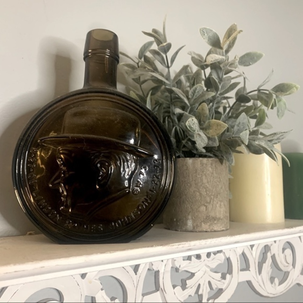 Vintage Brown Glass Bottle with Embossed Design